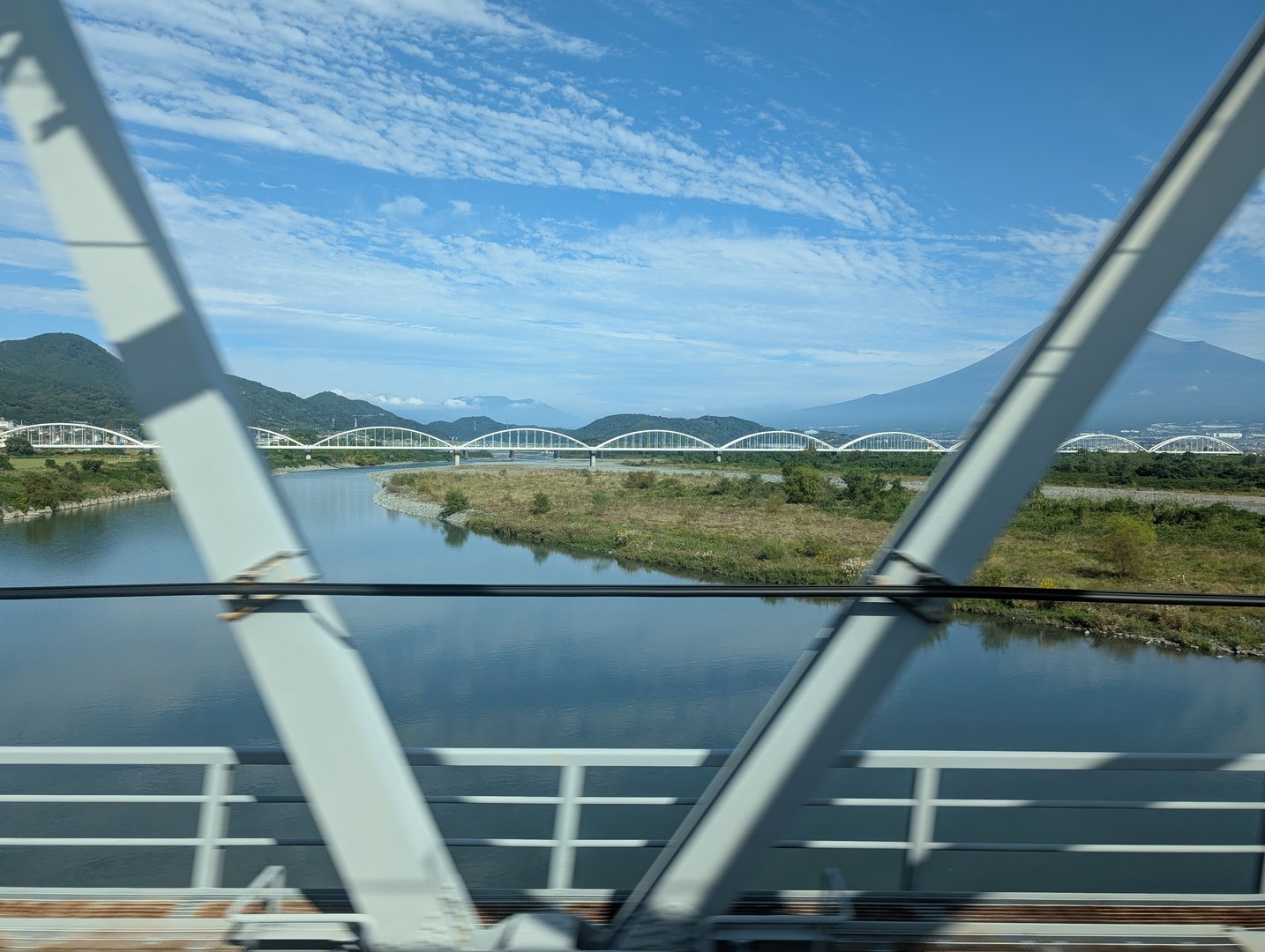 quick shot from the shinkansen crossing the fujikawa river - those white bridges against mt. fuji in the background are PEAK japan