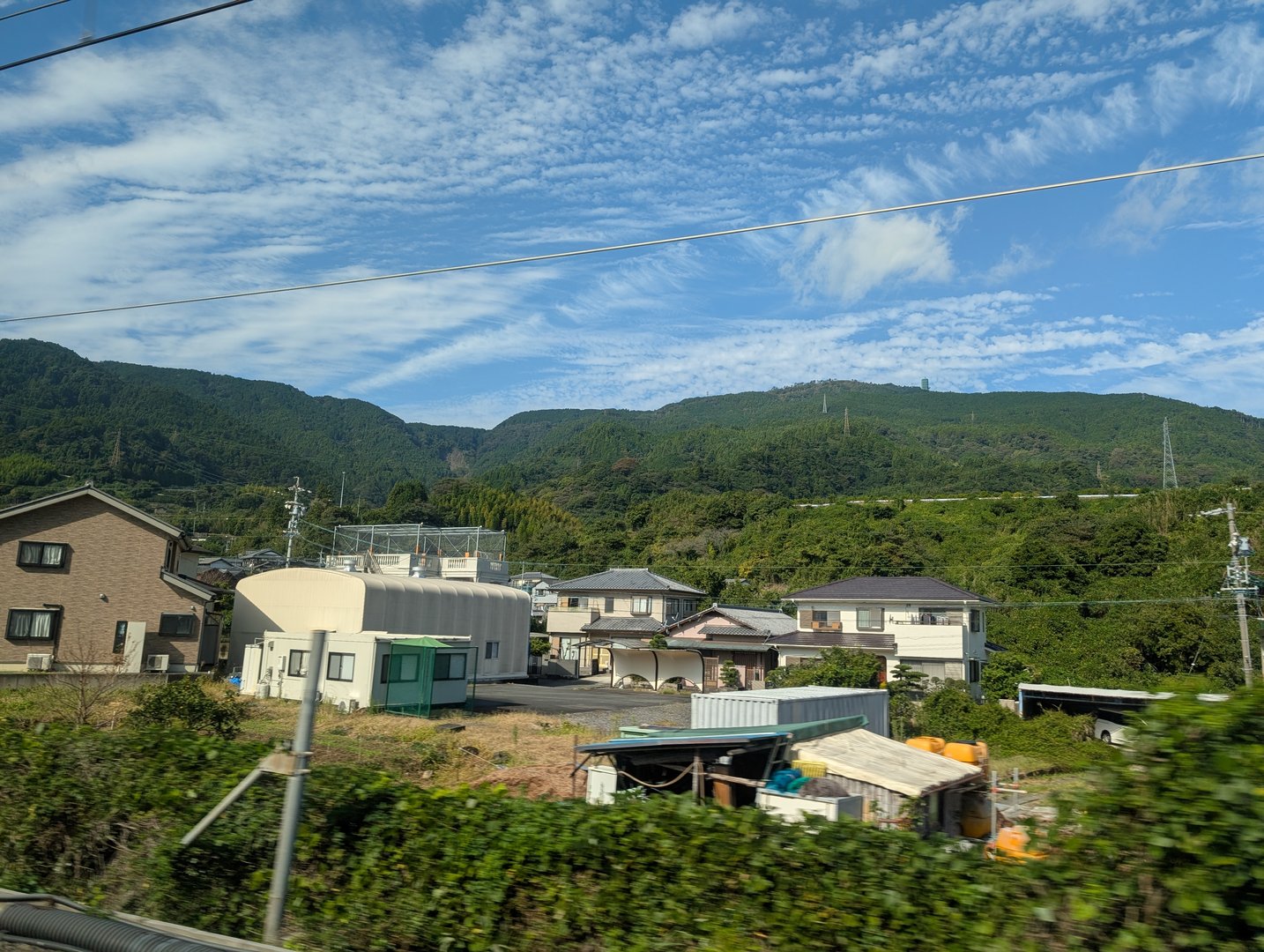 quick glimpse of everyday life in fuji from the shinkansen window - those altocumulus clouds though