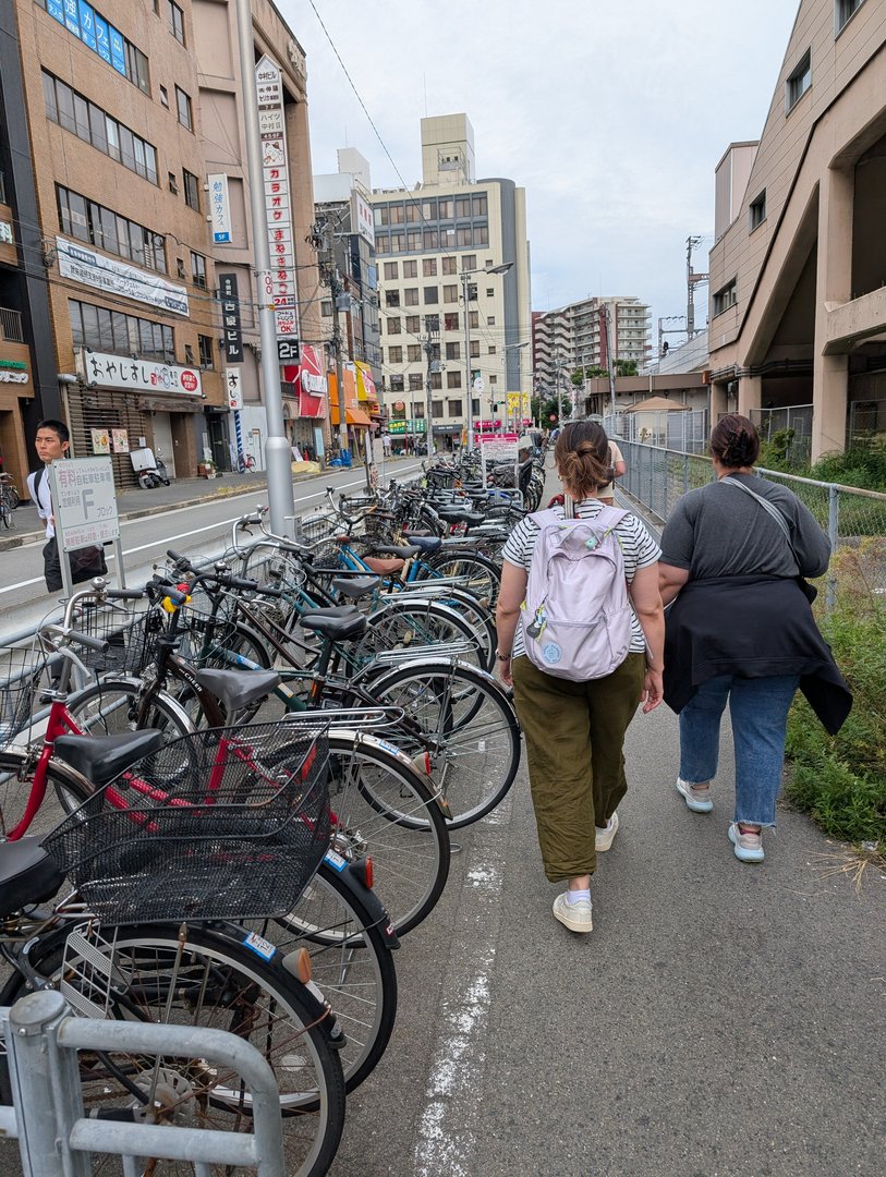 ashley and christina exploring the streets near teradacho station - the WALL of parked bikes is so osaka