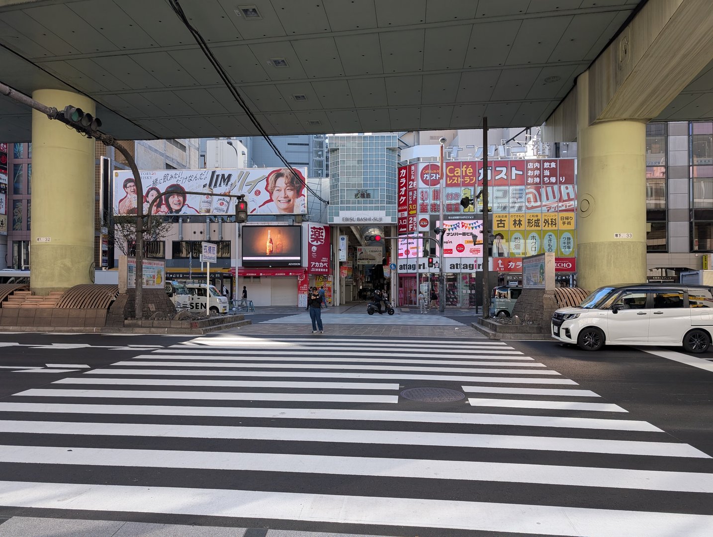 early morning in osaka's namba district - chuck caught this quiet moment before the usual crowds hit the famous zebra crossing