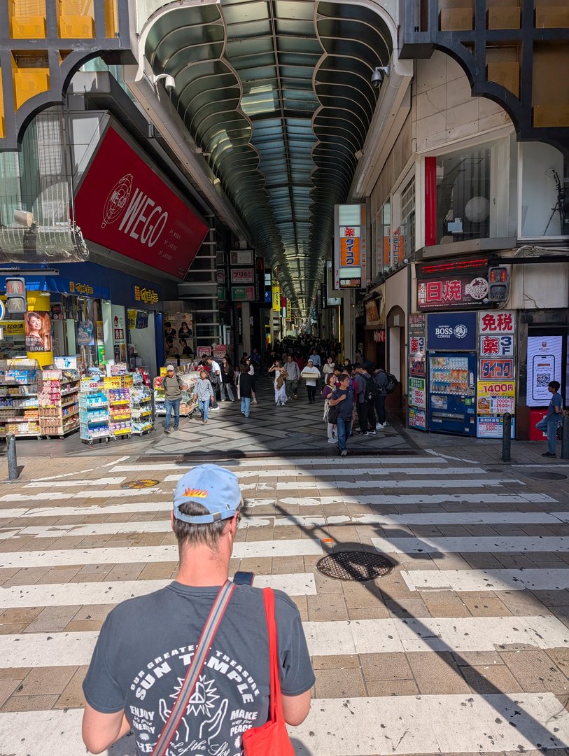 chuck checking out the endless shopping arcade in dotonbori - these covered shopping streets are EVERYWHERE in osaka