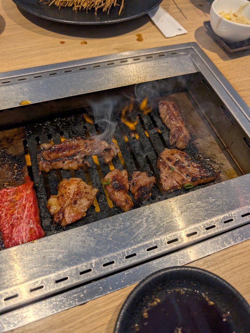 lunch spot in dotonbori serving up some LEGIT yakiniku - chuck and ashley found this place on google maps with 4.8 stars and it did not disappoint