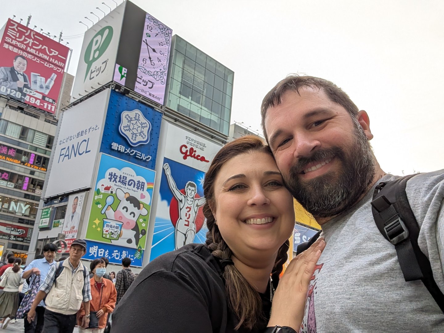 daniel and christina getting their first taste of dotonbori's sensory overload - those billboards are no joke