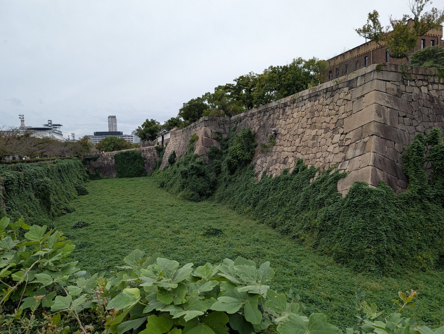 early morning walk around the MASSIVE stone walls of osaka castle. chuck managed to capture this moat view before the crowds showed up.