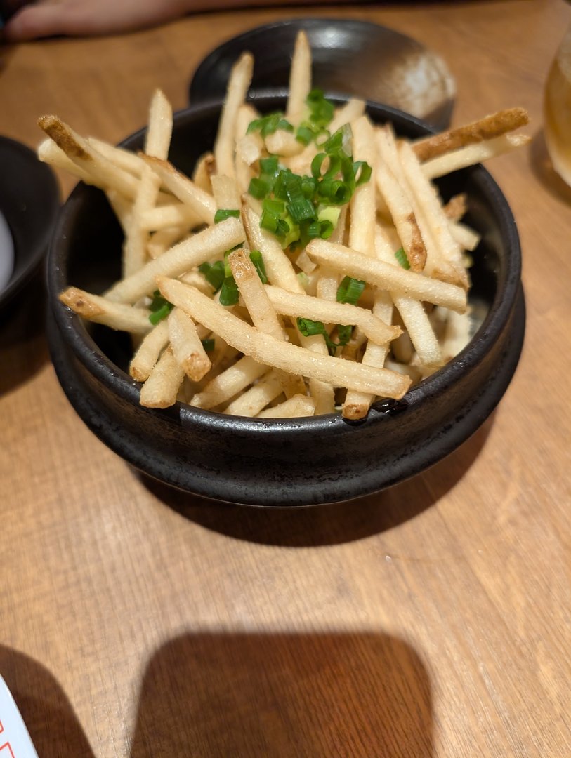 late night fries at an izakaya in shinjuku - these aren't your average mcdonald's fries, they're topped with green onions and japanese mayo