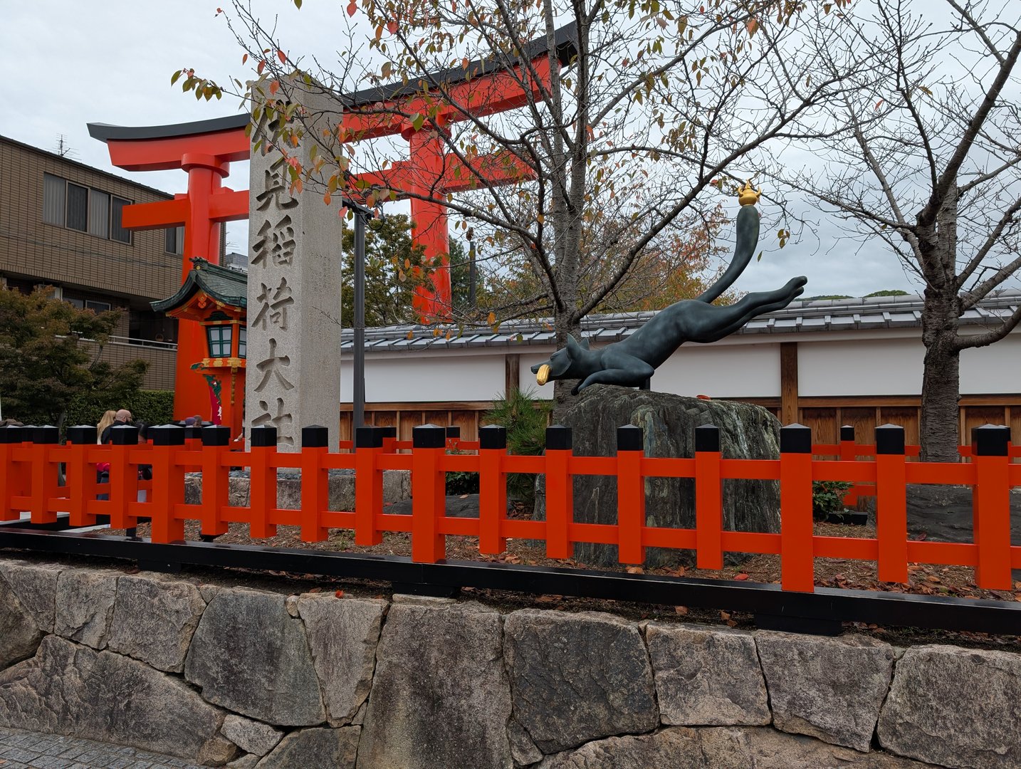 spotted this playful cat statue chasing a golden ball at fushimi inari shrine - chuck's getting pretty good with these shrine shots