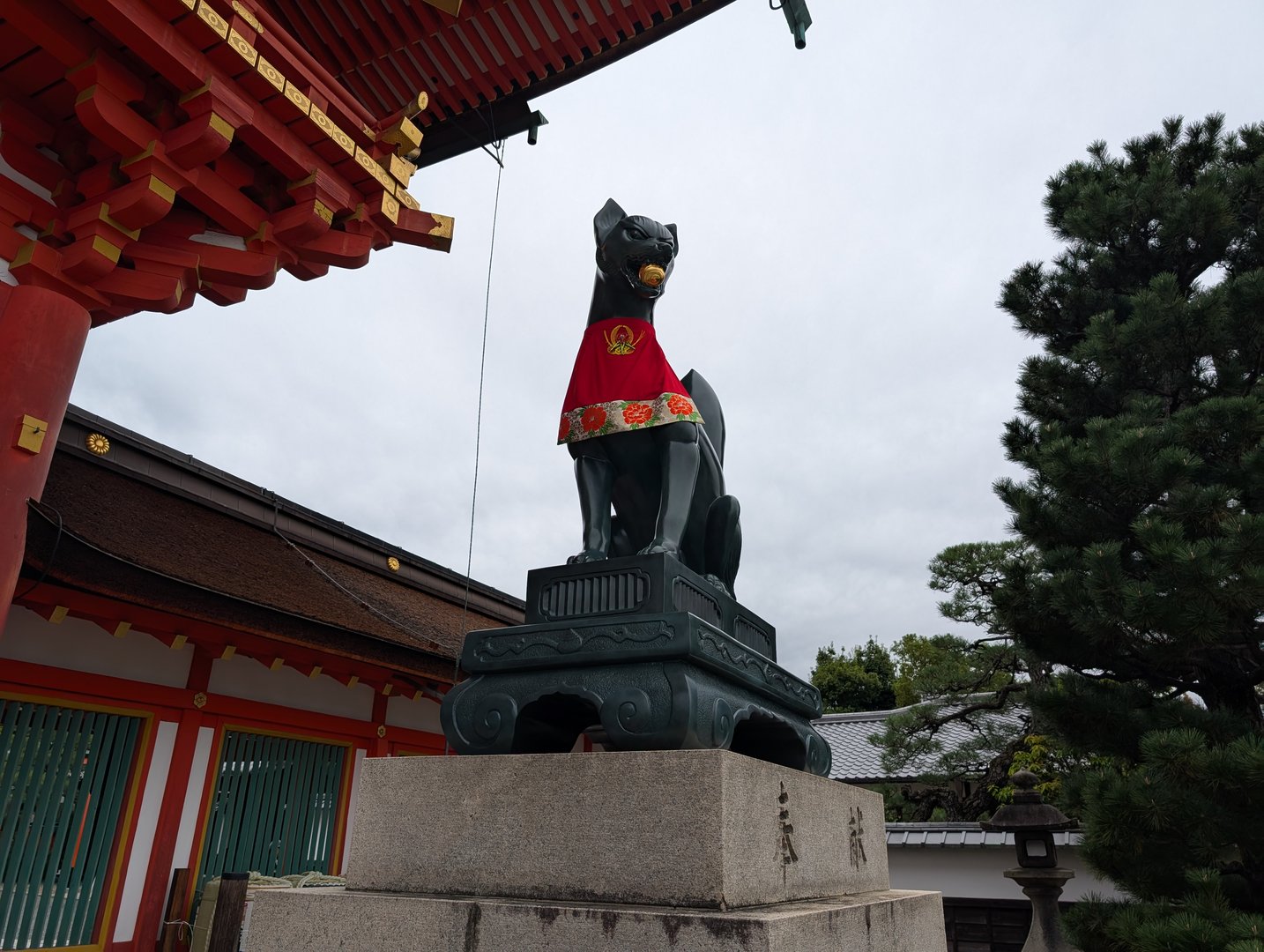 chuck caught this iconic fox statue at fushimi inari shrine on our morning walk through the ENDLESS red gates