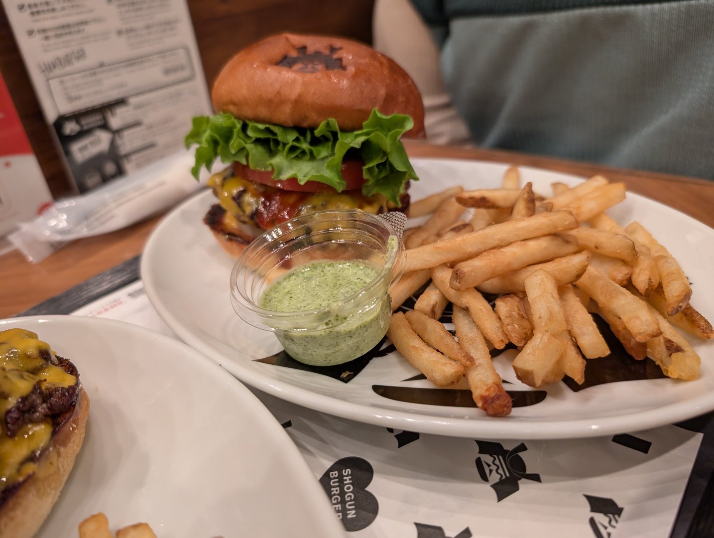 lunch break at shogun burger in akihabara - chuck's photo of their MASSIVE wagyu burger with matcha dipping sauce for the fries. way better than we expected for a burger in japan