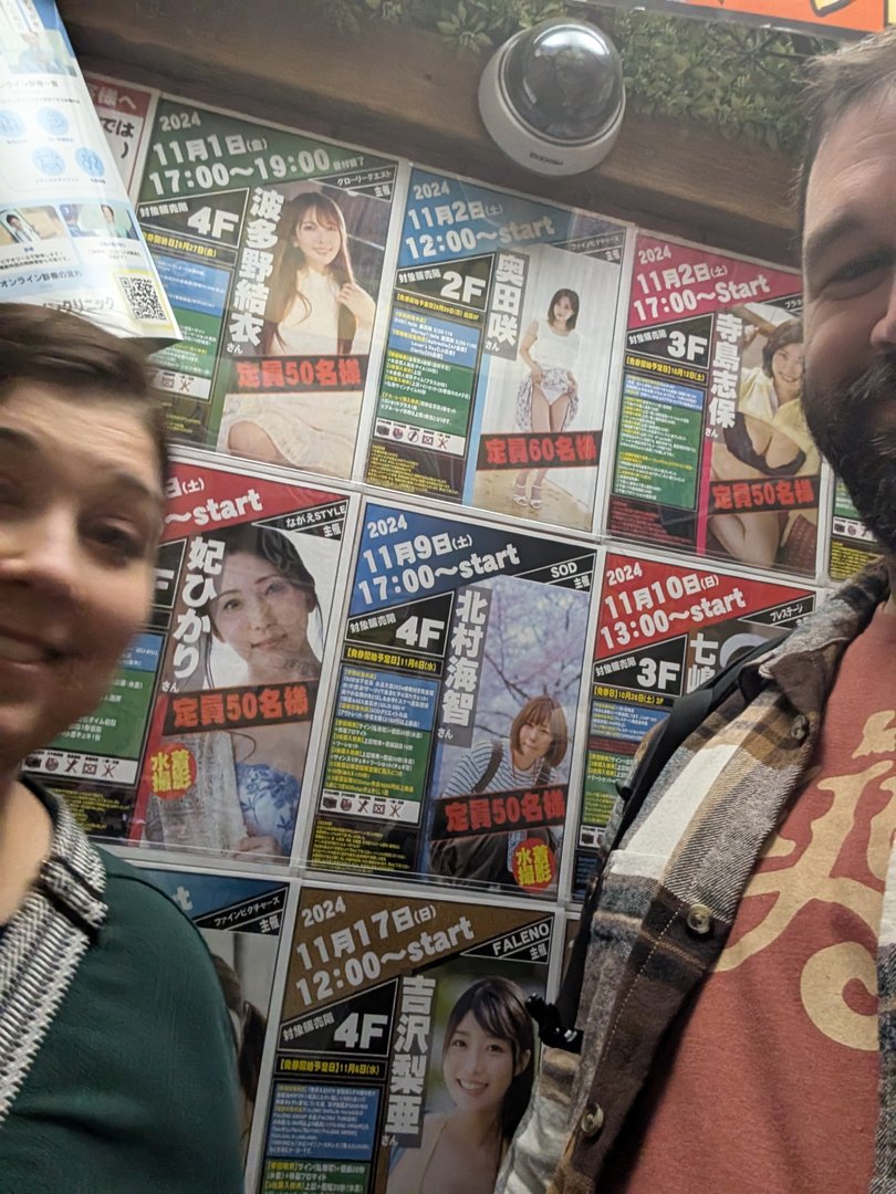 ashley and chuck stumbled across a wall of idol meet-and-greet posters in chiyoda - definitely NOT what they expected to find in tokyo's business district