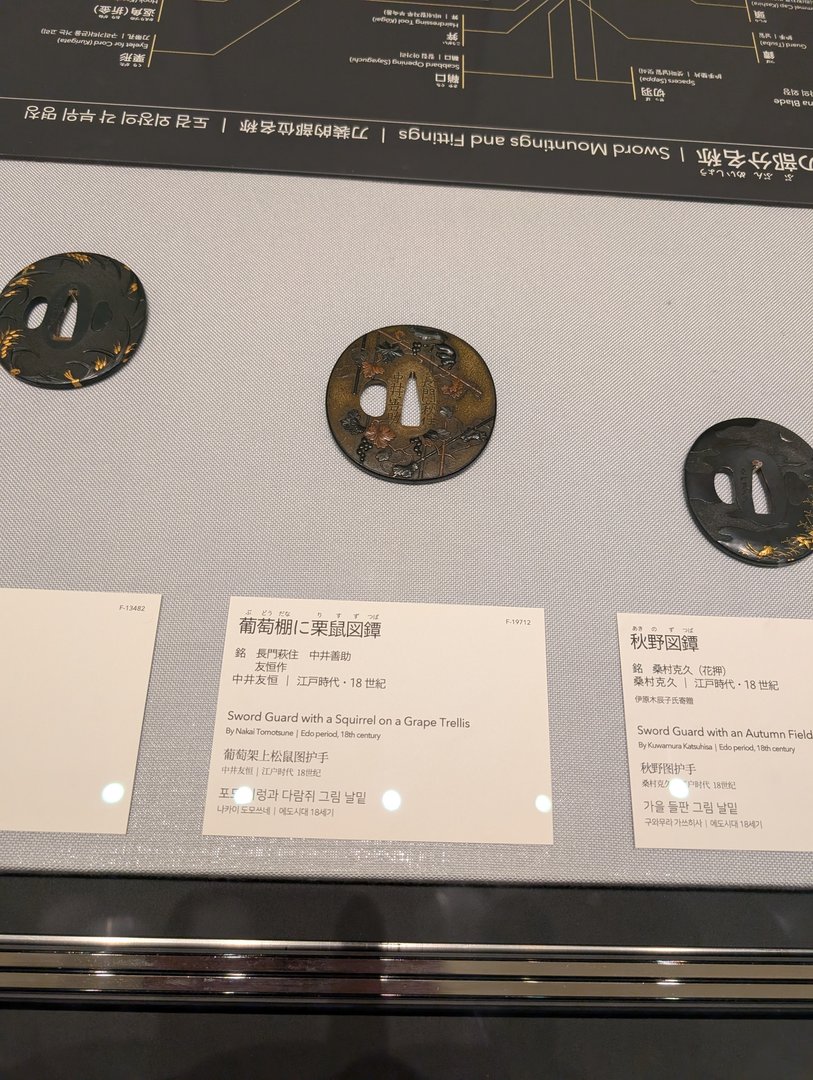 checking out some INCREDIBLE edo period sword guards at the tokyo national museum. chuck got way into these after watching way too many samurai documentaries.