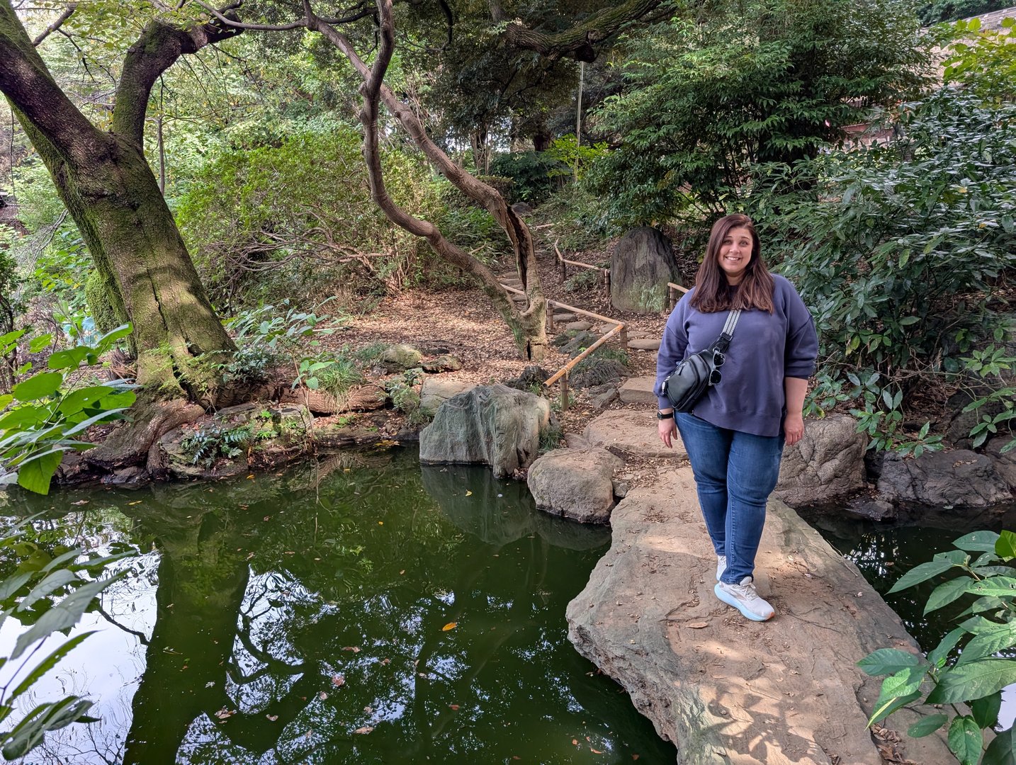 ashley taking a breather by a quiet pond in ueno park, right next to the tokyo national museum. these hidden spots make tokyo feel less INTENSE.