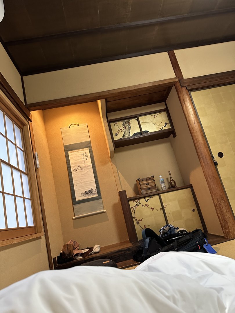 early morning view from the futon in our traditional osaka house. the kakemono scroll and shoji screens hit different when you're actually waking up to them.