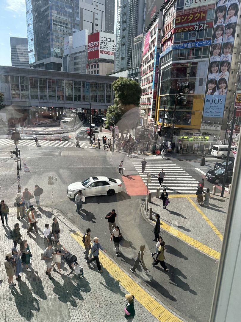 bird's eye view of the FAMOUS shibuya crossing from starbucks - dan's first time seeing the organized chaos in action