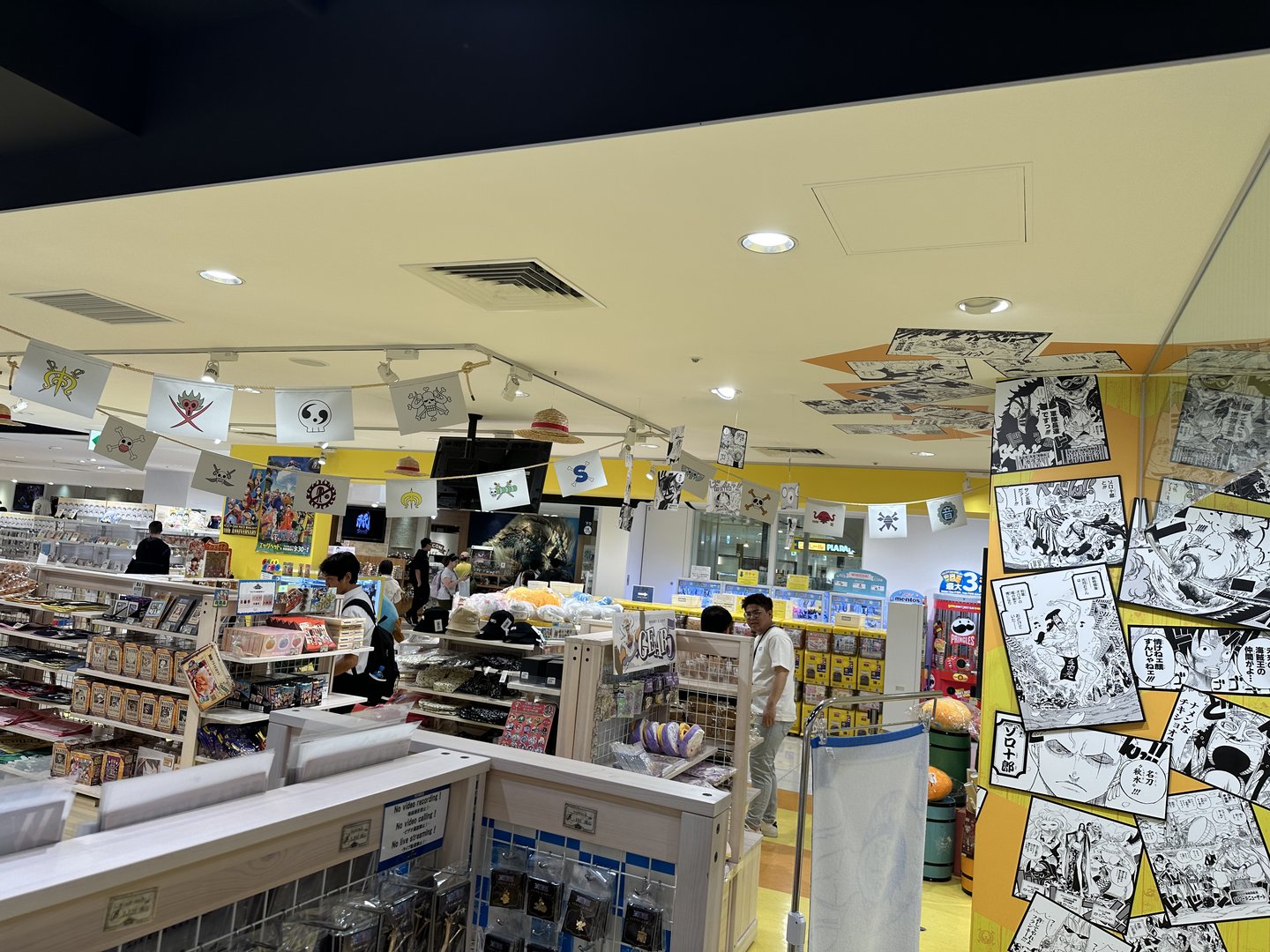 dan dragged christina to yet another manga shop in osaka - this one's got some SERIOUS one piece vibes going on with those flags and wall art