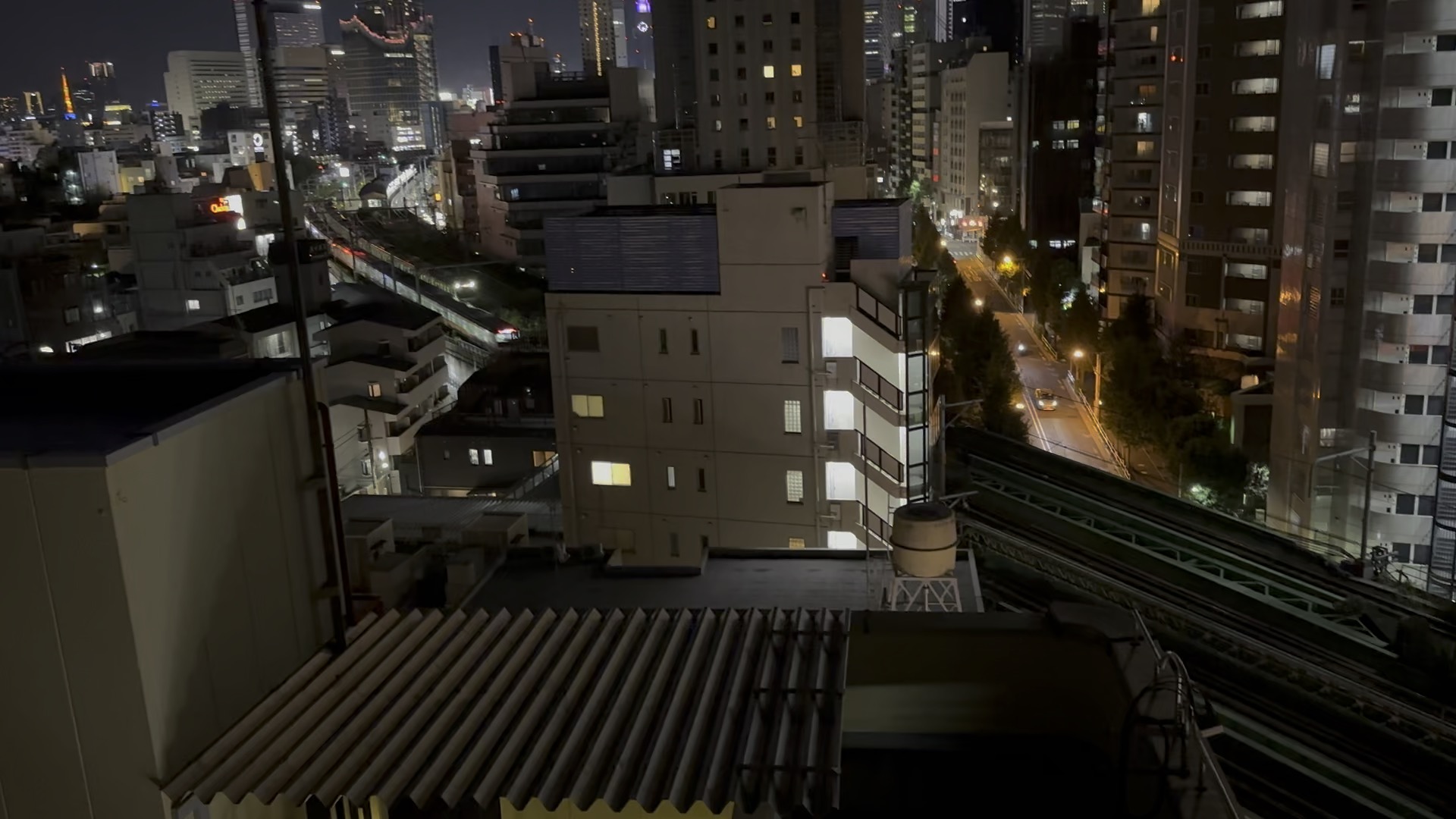 night view from our tokyo airbnb balcony - you can see the yamanote line snaking through the buildings