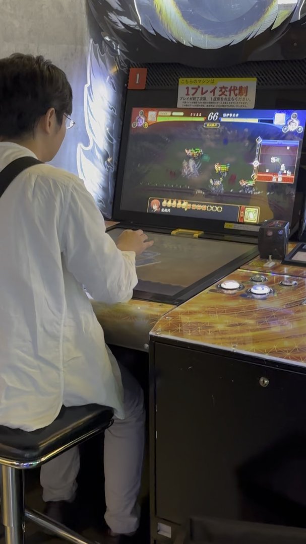 dan testing his skills at a japanese arcade in tokyo, where even the fighting games are next level