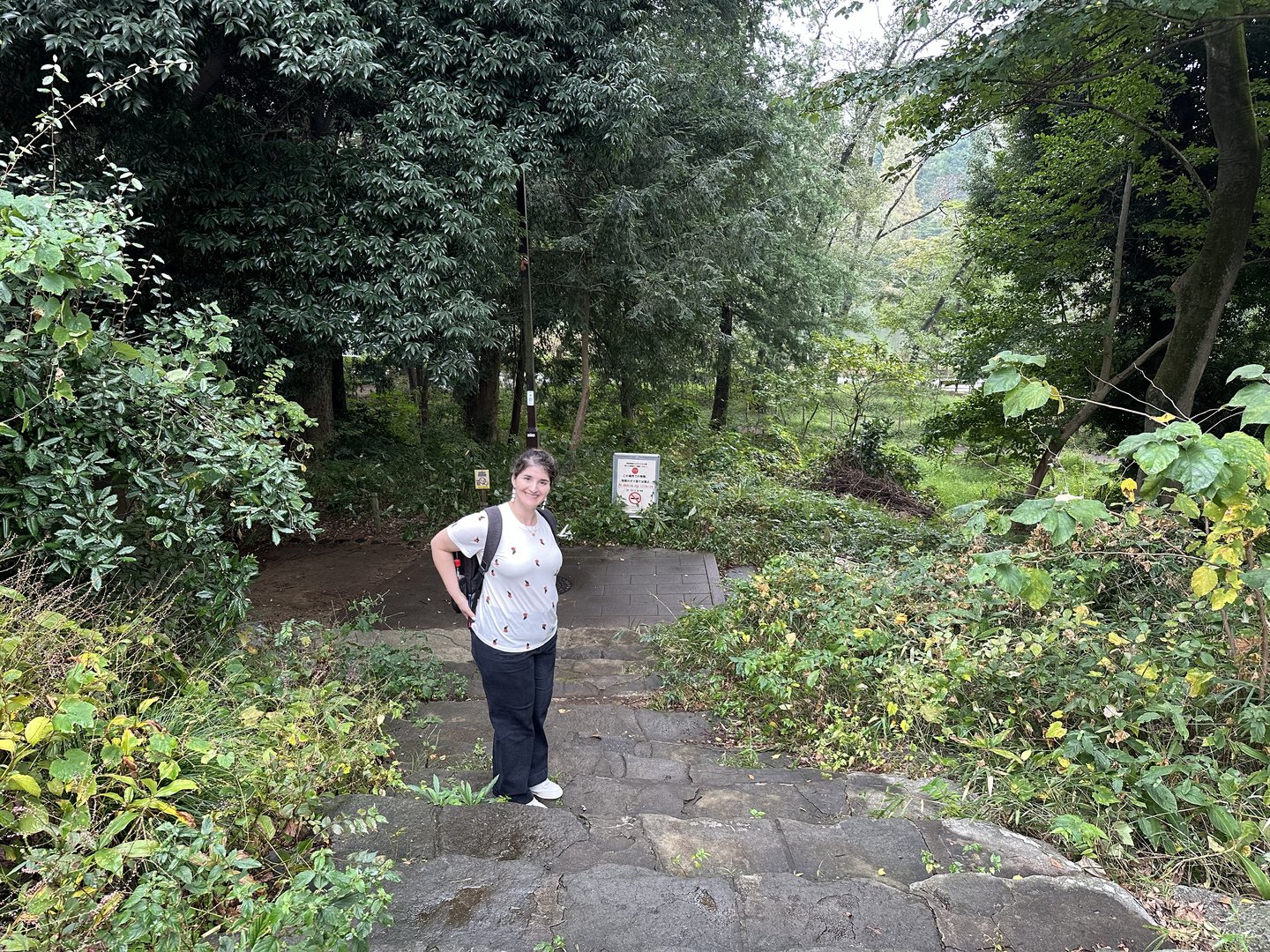 christina taking a quick break on the stone path while exploring inokashira park, one of tokyo's most CHILL green spaces