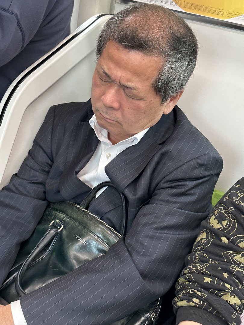 caught this classic sight on the tokyo metro near ueno station - the legendary 'inemuri' power nap in action