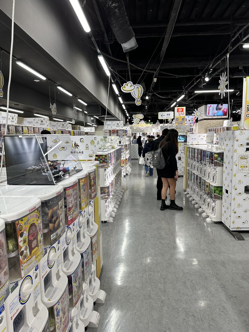 christina checking out the endless rows of gacha machines at sunshine city's namco arcade. these things are EVERYWHERE in tokyo.