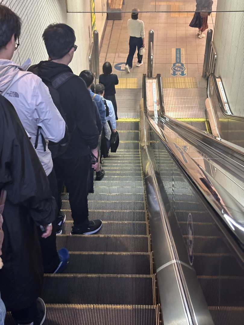 day 3: dan caught this shot of the VERY japanese sight of everyone perfectly lined up on the right side of the escalator at gotokuji station