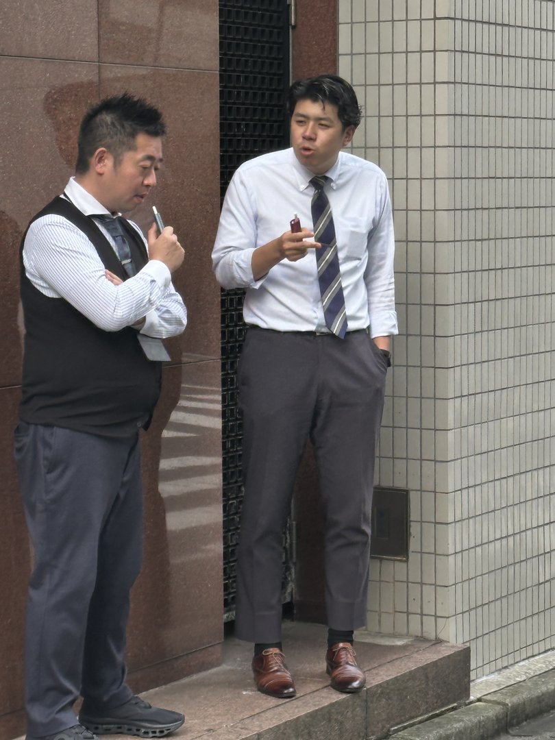 caught these office workers on their smoke break in ikebukuro - a VERY common sight in tokyo's business districts despite japan's reputation for politeness and order