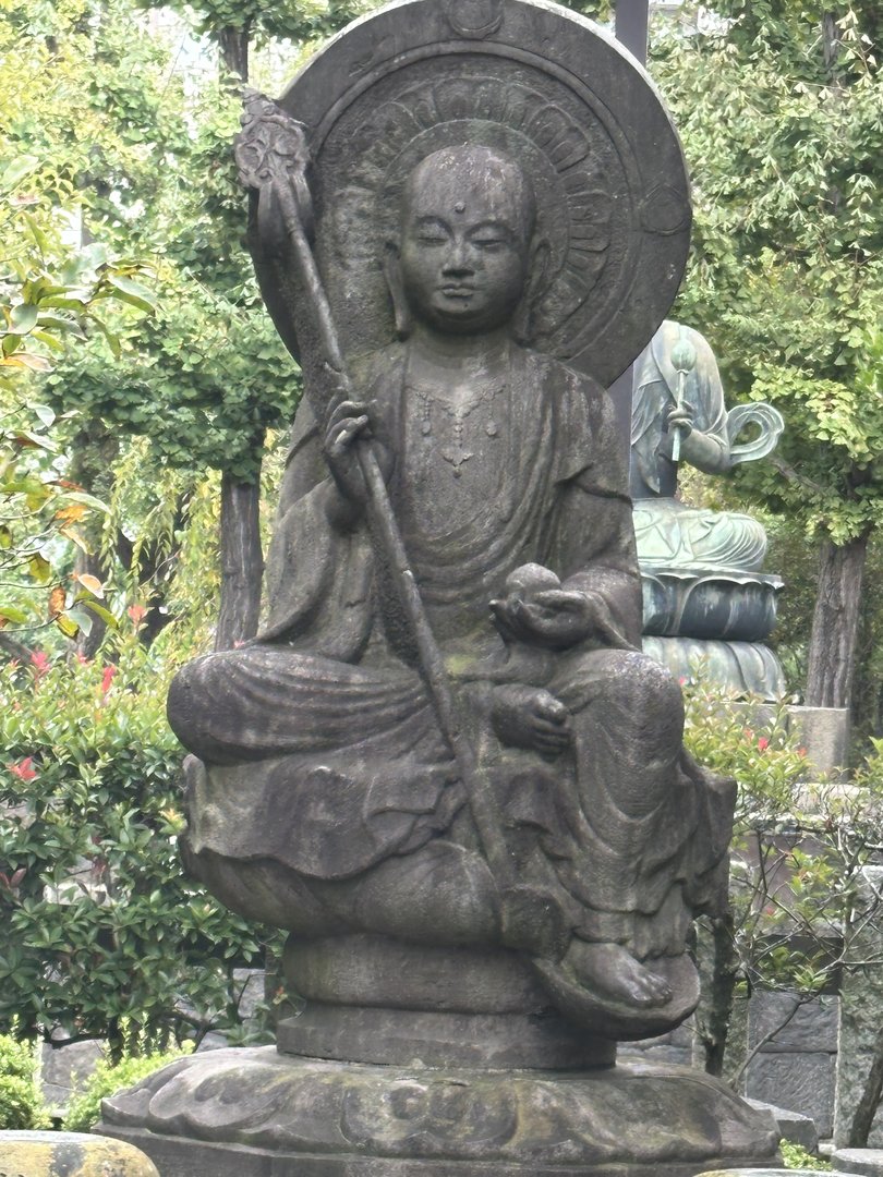 early morning wandering through the gardens at sensoji temple led to this peaceful buddha statue tucked away among the greenery