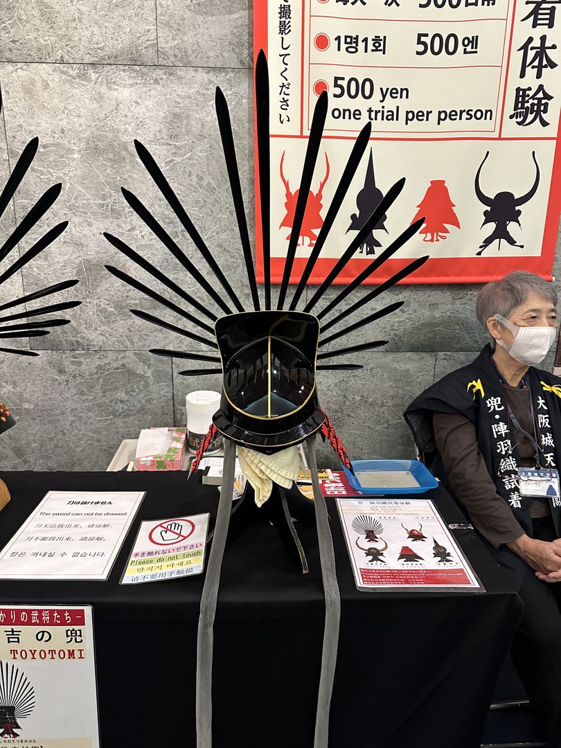 500 yen to try on a samurai helmet at osaka castle - dan couldn't resist getting the full TOYOTOMI experience