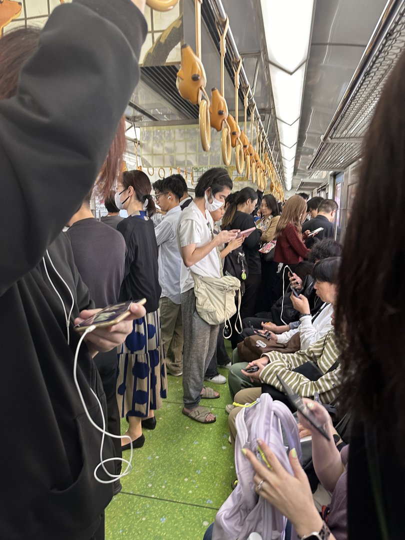 morning rush hour on osaka's subway - everyone's in their own phone bubble just like back home