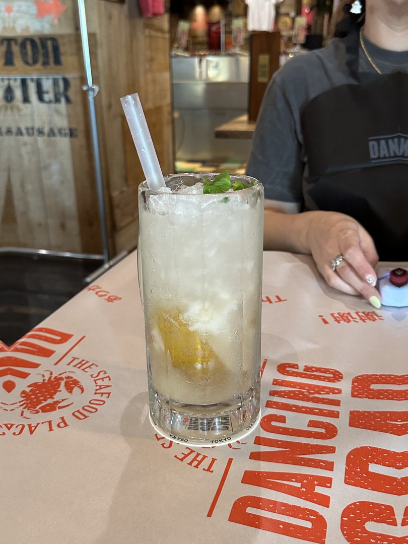 christina trying out a yuzu highball at the seafood place in shinjuku - these drinks are WAY better than regular highballs