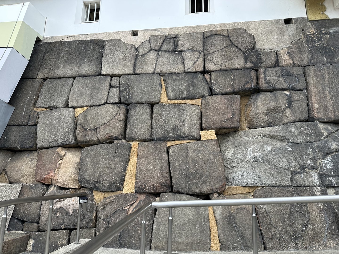 checking out the original stone walls near osaka castle - these massive blocks have been here since the 1600s and were cut without any power tools