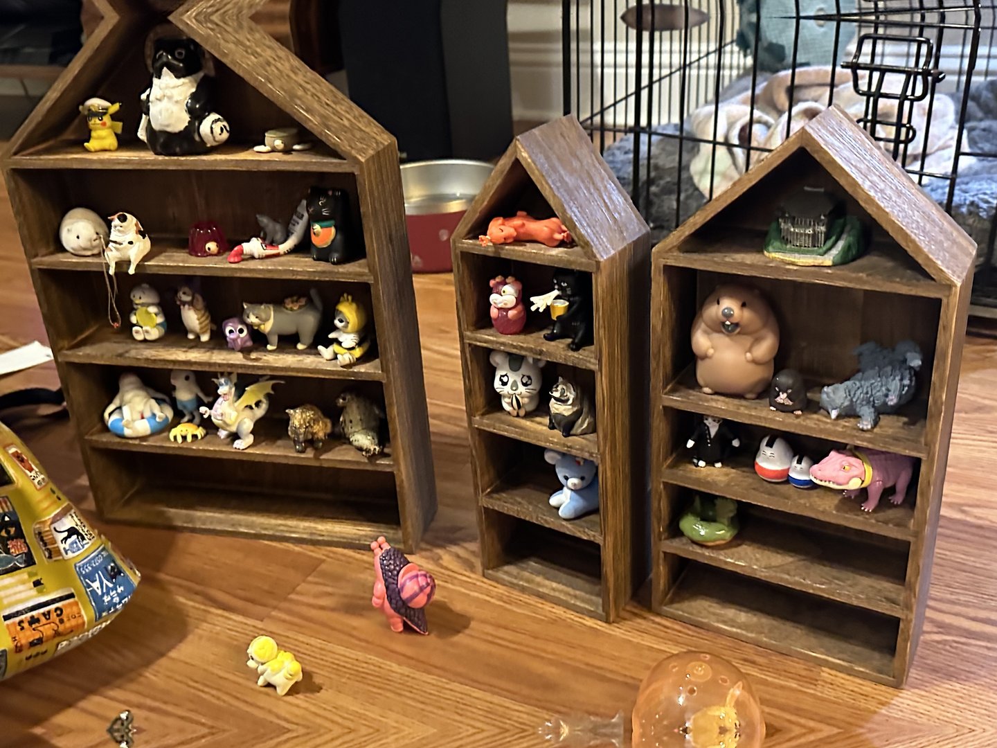 christina's growing collection of japanese gachapon toys displayed in wooden house shelves - the REAL souvenirs from this trip