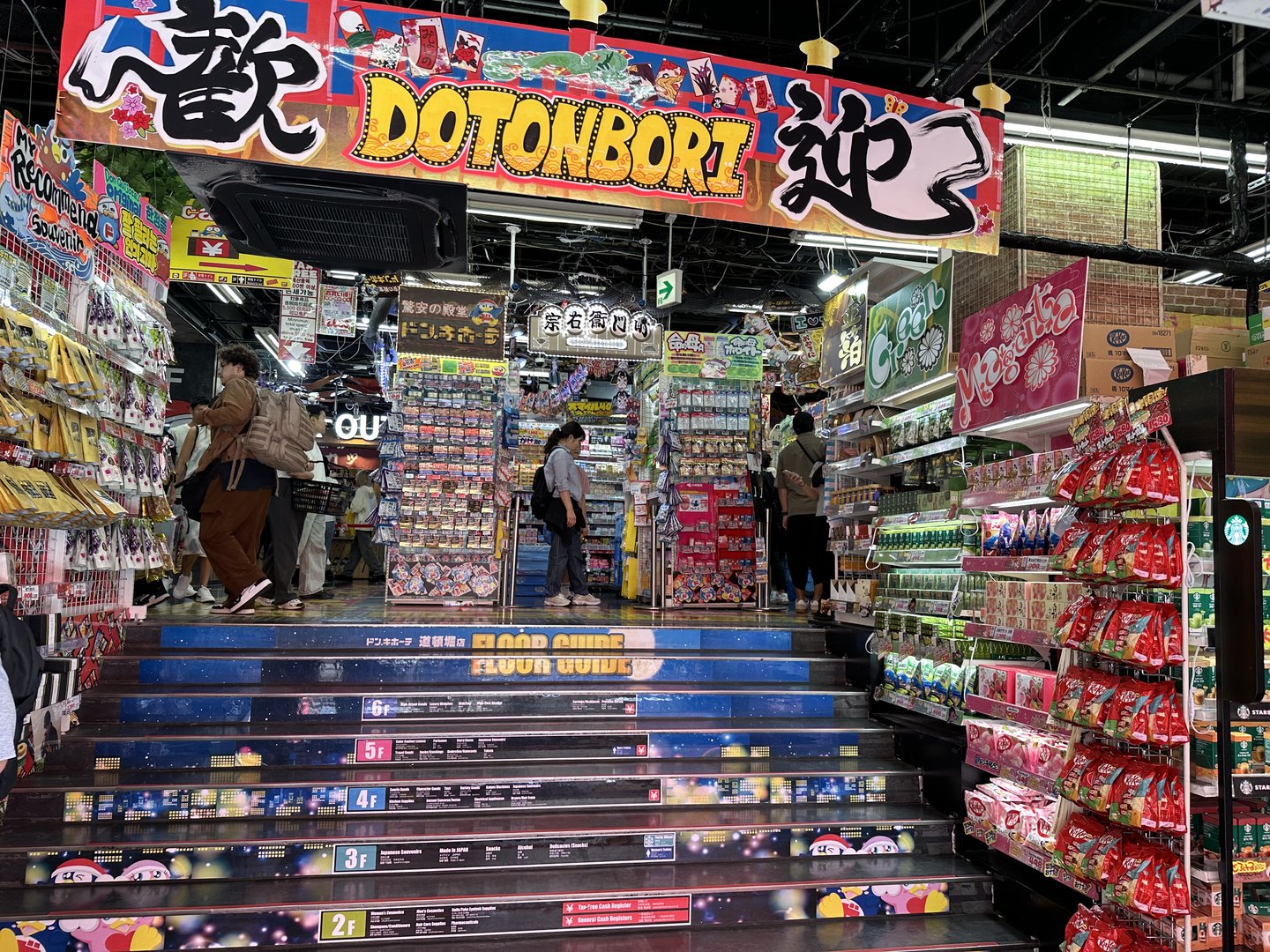 inside the WILD dotonbori shopping arcade - these multi-level snack shops are no joke. christina's already spent way too much on kit kats