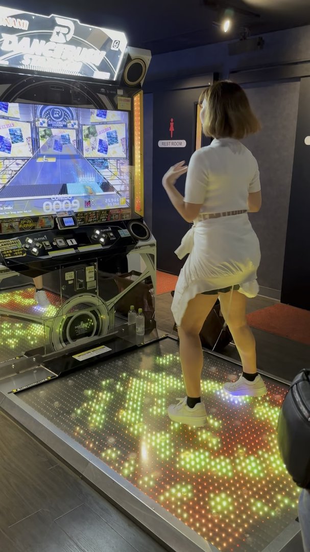 christina showing off her dance moves at a round1 arcade in osaka. these dance games are NO JOKE here.