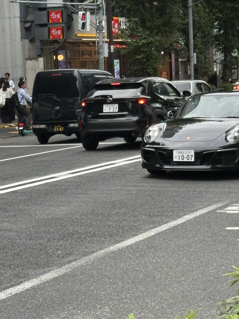 spotted this porsche 911 in shibuya - wild to see luxury cars mixed with tiny kei vans on these narrow streets