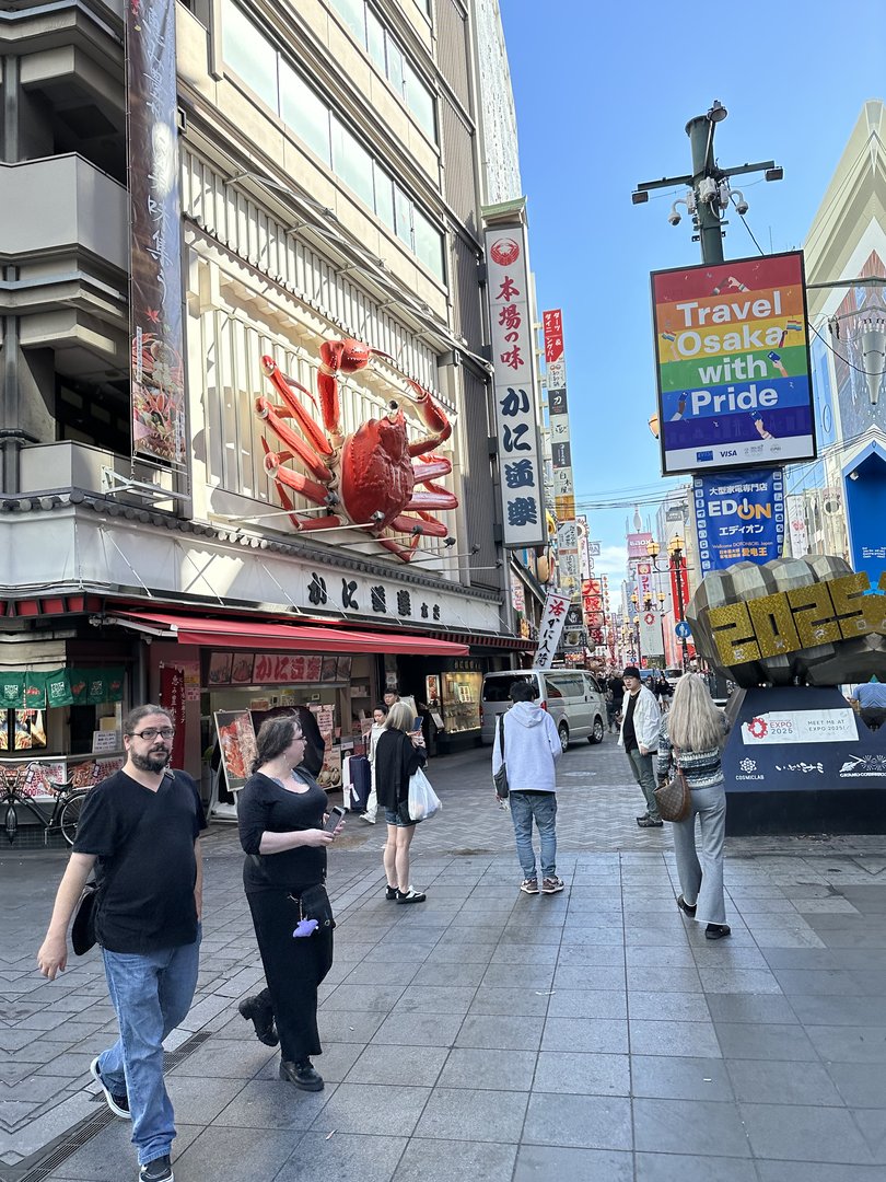 christina and dan checking out the famous giant crab in dotonbori - this mechanical marvel moves and steams every few minutes